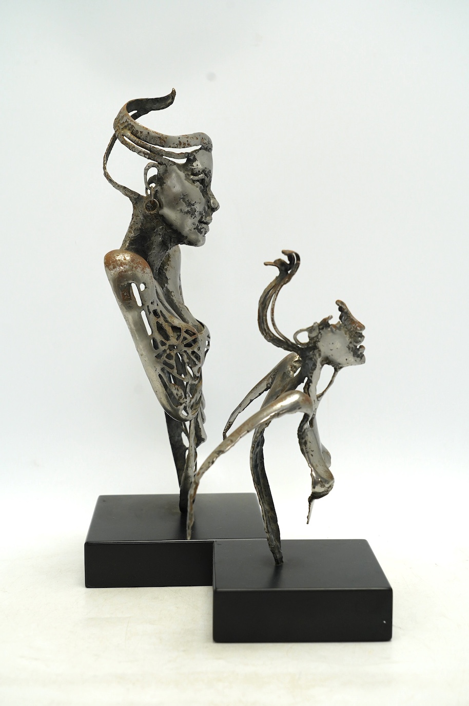 Two contemporary 'Brutalist' cast iron sculptures, initialled RI, tallest 39cm. Condition - fair to good